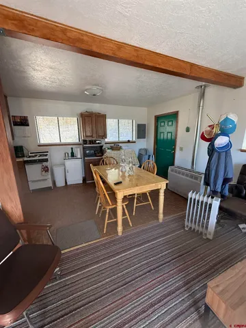 a living room with a couch and a stove top oven