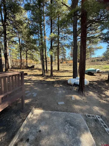 a view of a roof deck with wooden floor and city view