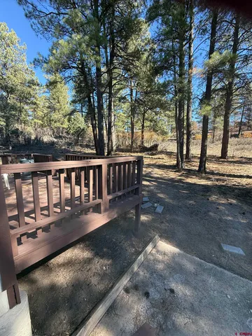 a view of a house with a tree in the background
