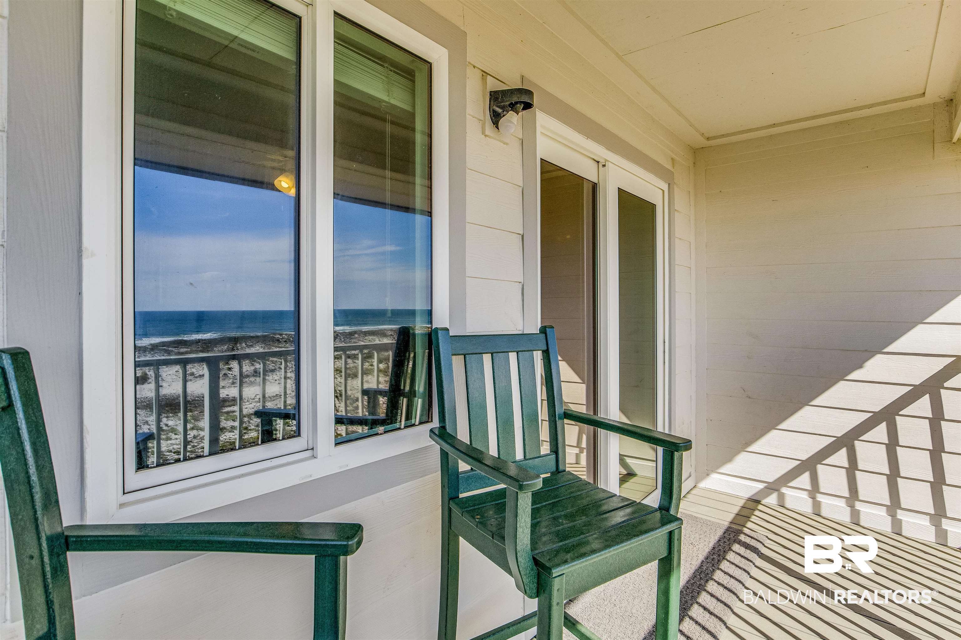 400 Plantation Road, Unit 1303 Gulf Shores, AL 36542 - Photo 11 of 24 Balcony with a water view & polywood chairs