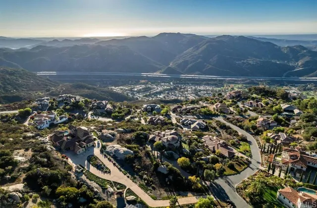 an aerial view of house with yard