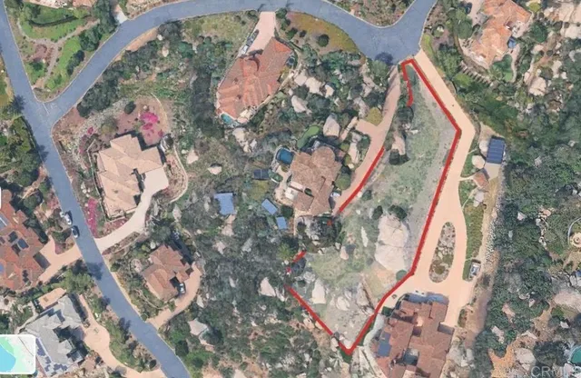 a view of a house with a mountain in the background