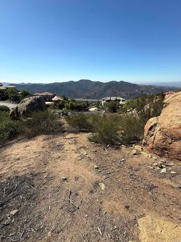 a view of outdoor space with mountain view in back