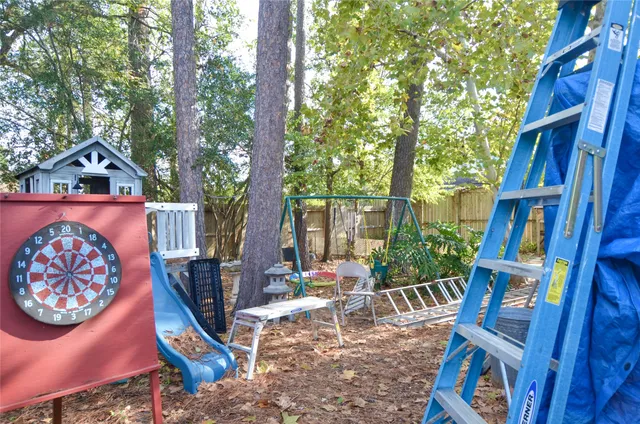 a front view of house with yard outdoor seating and green space
