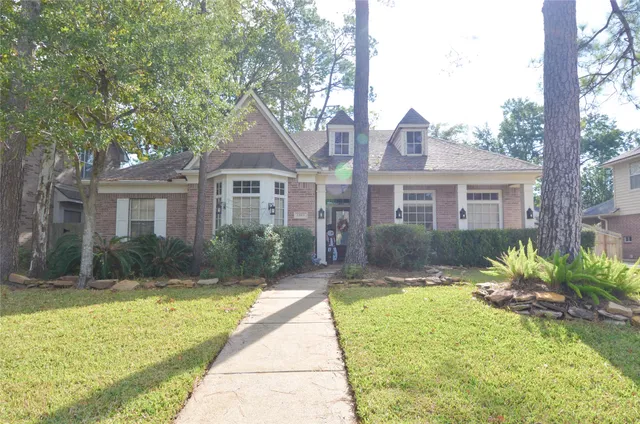 a front view of a house with a yard and porch