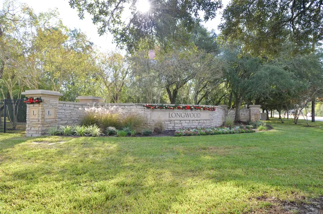 a garden with trees in front of it