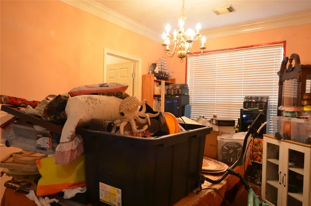 a living room with furniture a dining table and chairs