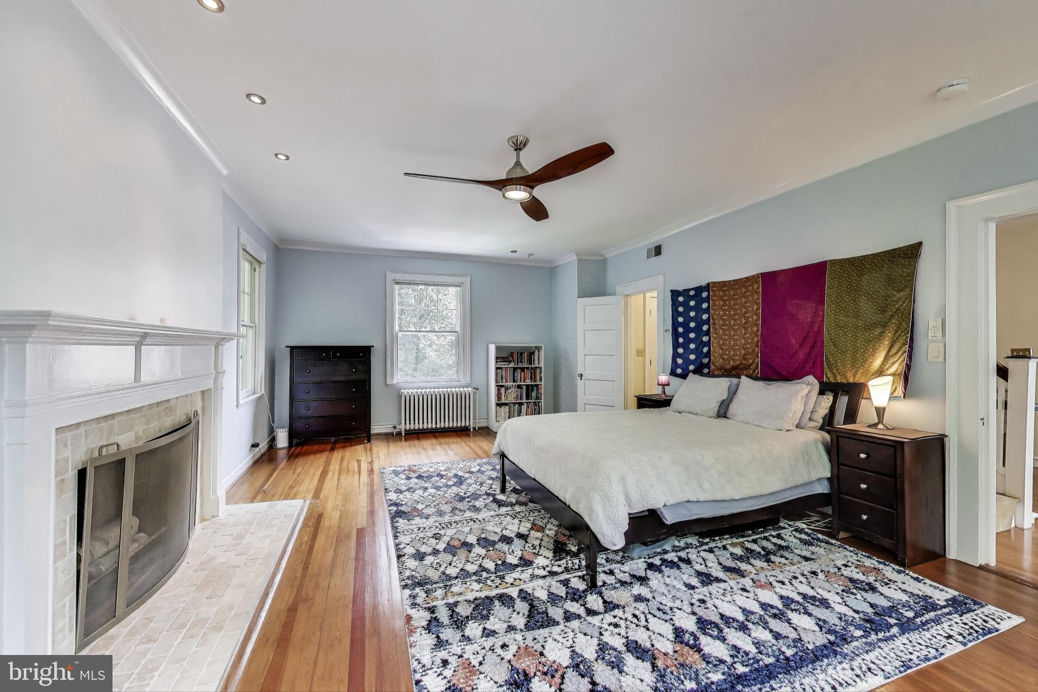 5809 Grosvenor Lane Bethesda, MD 20814 - Photo 15 of 41 Primary Bedroom with Fireplace - What Ambience!