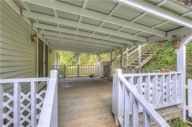 550 Puncheon Creek Road Lafayette, TN 37083 - Photo 16 of 20 The covered deck allows you to enjoy the sound of nature!