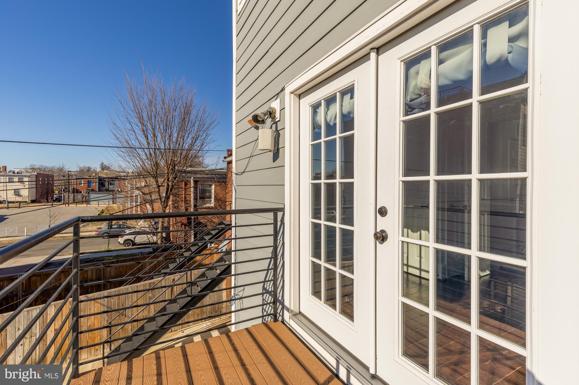 1609 Levis Street Northeast Washington, DC 20002 - Photo 13 of 35 a view of a balcony with wooden floor and fence