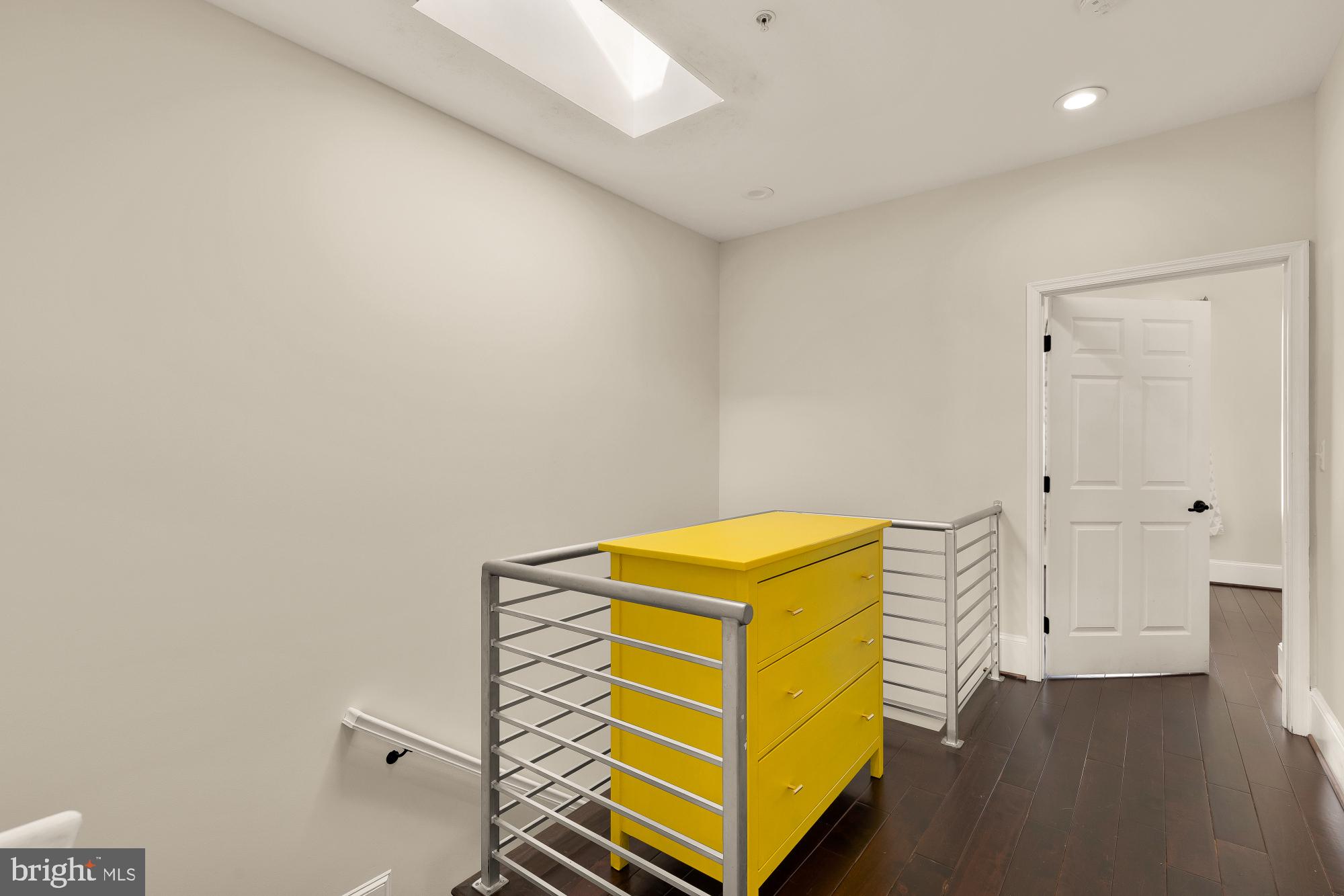 1609 Levis Street Northeast Washington, DC 20002 - Photo 21 of 35 a room with a bed and wooden floor