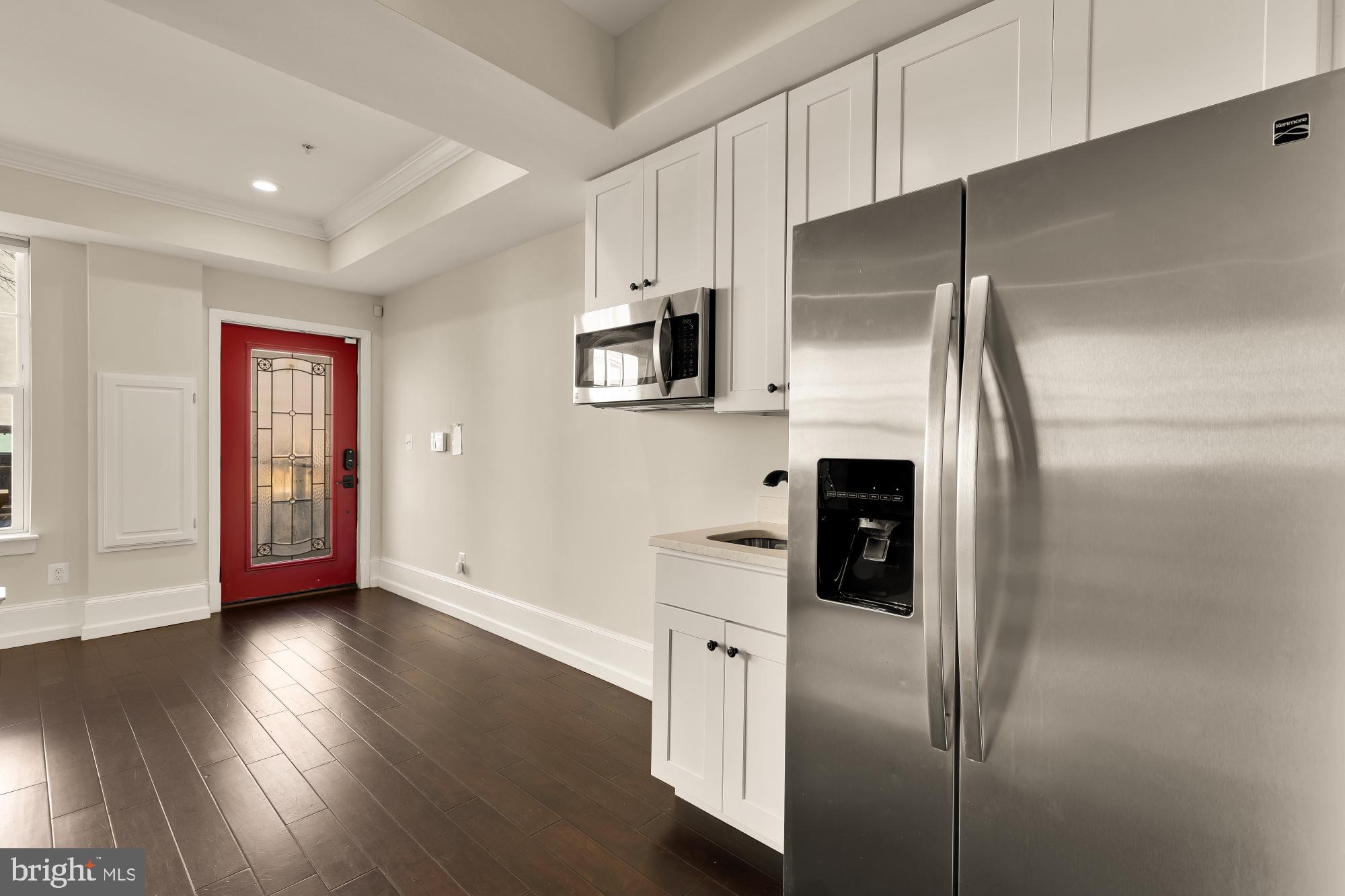 1609 Levis Street Northeast Washington, DC 20002 - Photo 28 of 35 a kitchen with stainless steel appliances a refrigerator and a stove top oven