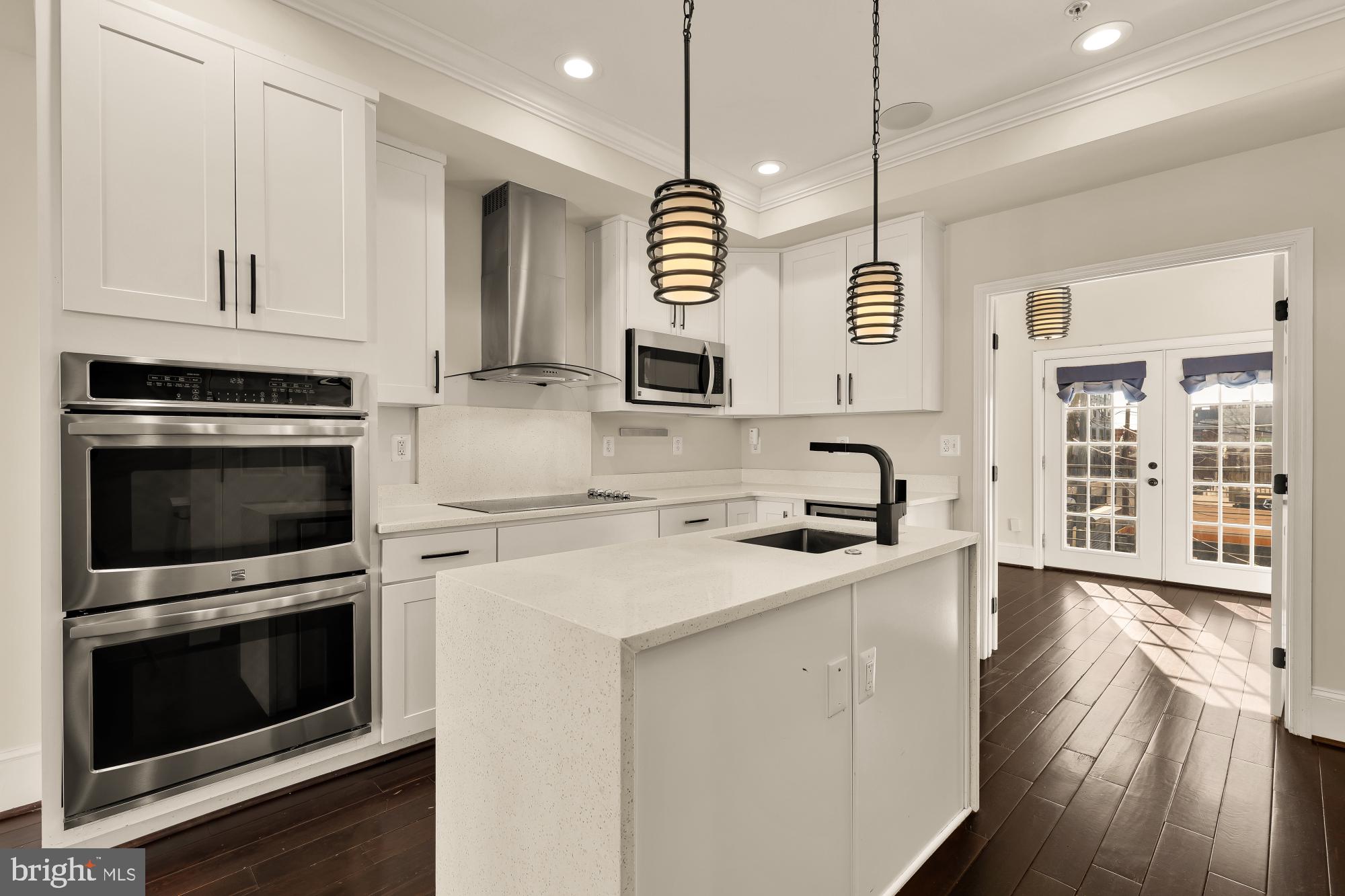 1609 Levis Street Northeast Washington, DC 20002 - Photo 8 of 35 a kitchen with granite countertop a stove and a sink