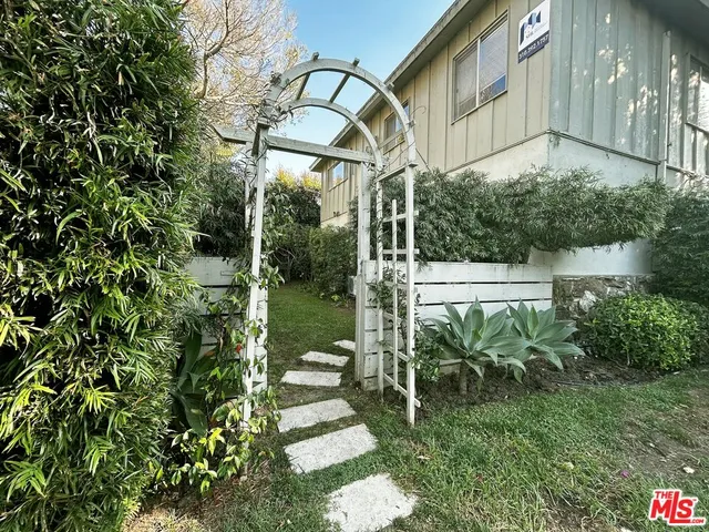 a kitchen with stainless steel appliances granite countertop a refrigerator stove microwave and sink