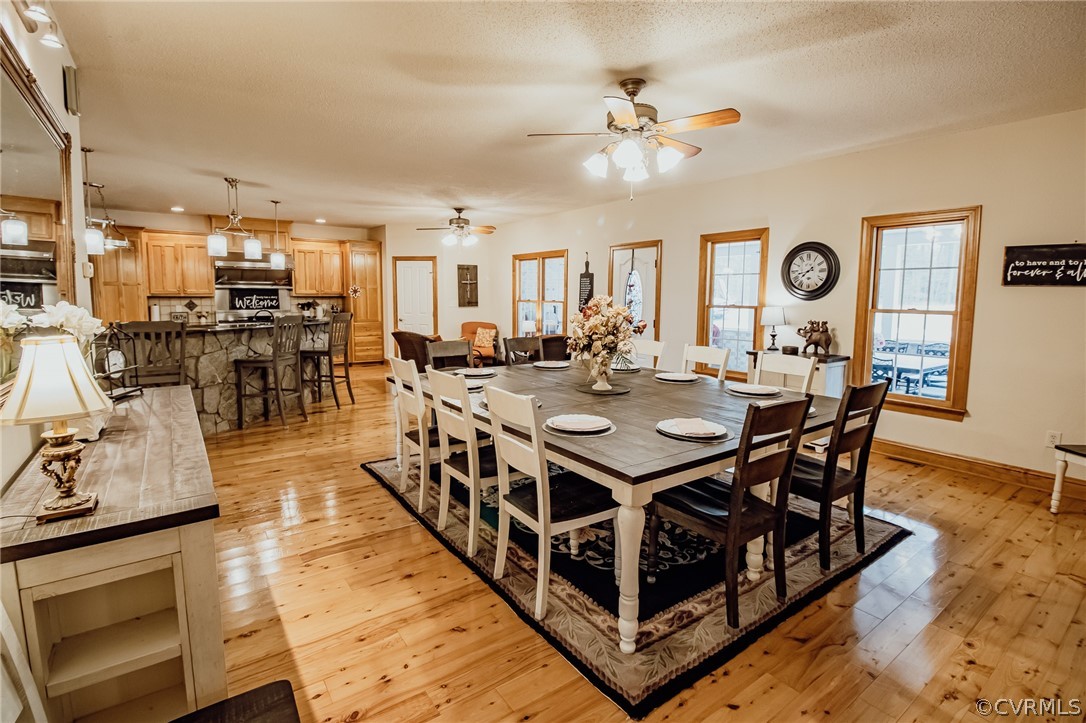 6809 West Quaker Road Disputanta, VA 23842 - Photo 11 of 49 a view of a dining room with furniture and chandelier