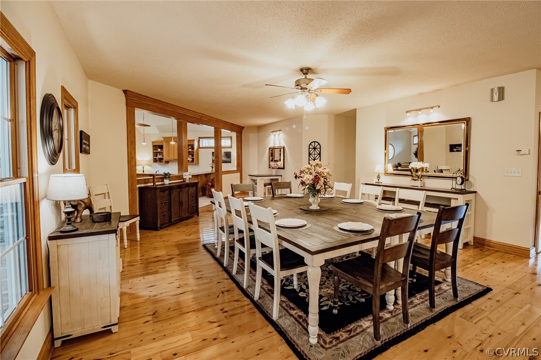6809 West Quaker Road Disputanta, VA 23842 - Photo 13 of 49 a view of a dining room with furniture a chandelier and wooden floor