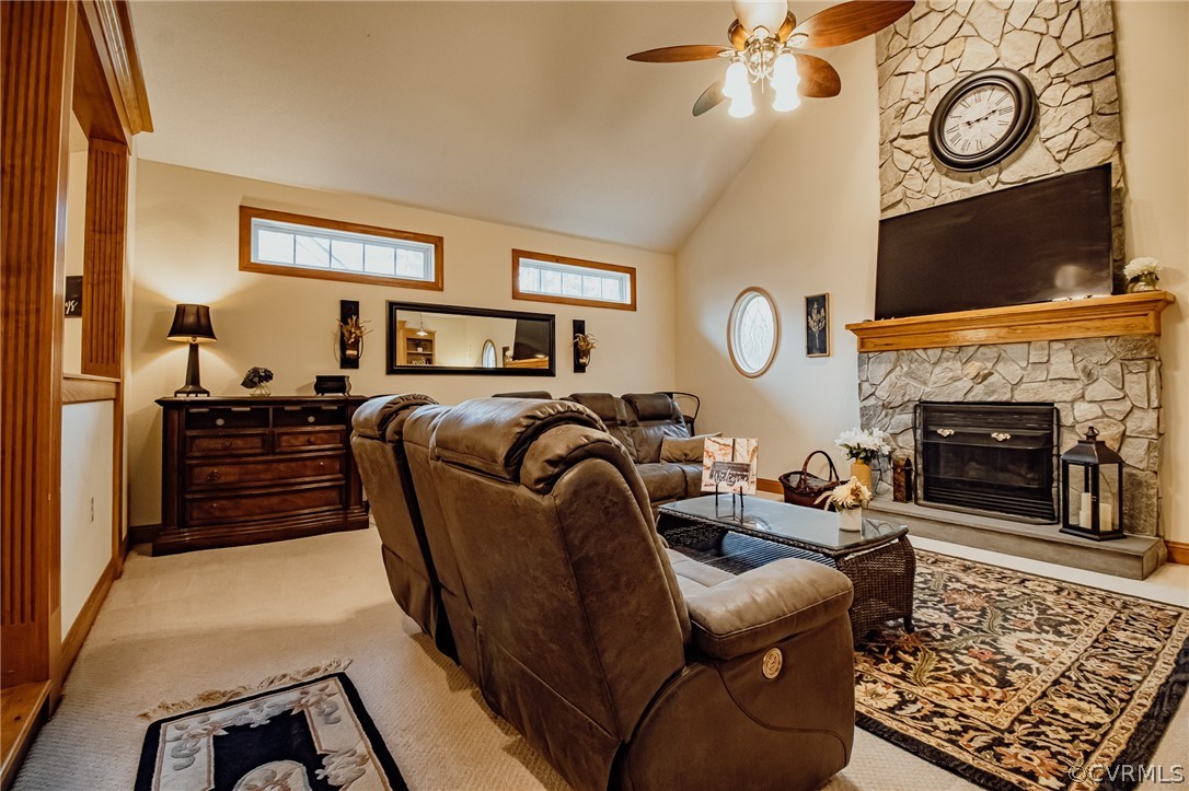 6809 West Quaker Road Disputanta, VA 23842 - Photo 17 of 49 a living room with furniture a clock and a fireplace
