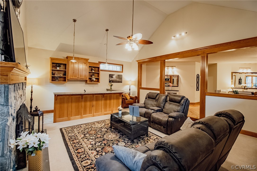 6809 West Quaker Road Disputanta, VA 23842 - Photo 18 of 49 a living room with furniture a chandelier and a flat screen tv