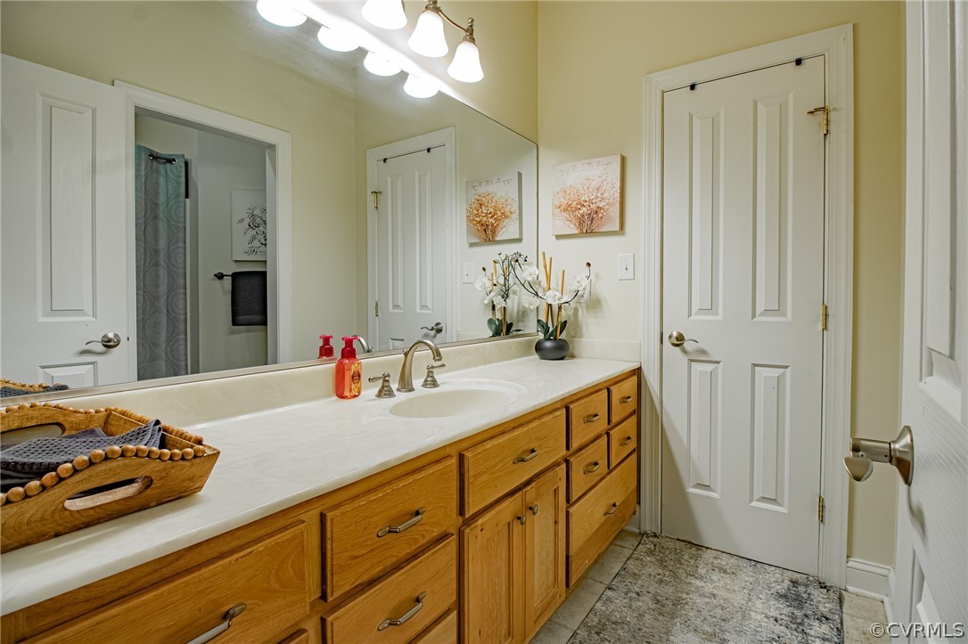 6809 West Quaker Road Disputanta, VA 23842 - Photo 19 of 49 a bathroom with a sink and a mirror