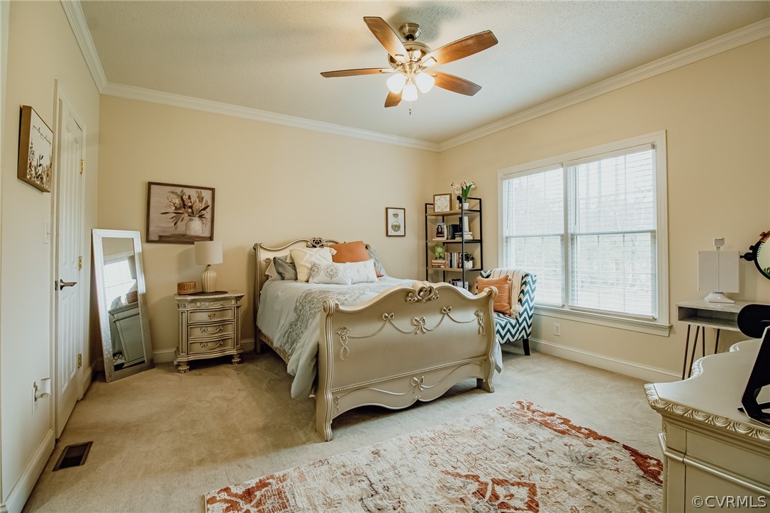 6809 West Quaker Road Disputanta, VA 23842 - Photo 22 of 49 a bed room with a bed and a couch