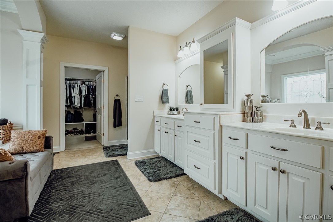 6809 West Quaker Road Disputanta, VA 23842 - Photo 31 of 49 a bathroom with a double vanity sink a mirror and a shower