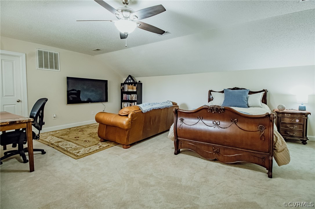6809 West Quaker Road Disputanta, VA 23842 - Photo 35 of 49 a bedroom with furniture and a ceiling fan