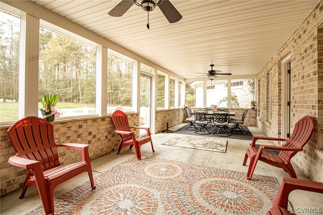 6809 West Quaker Road Disputanta, VA 23842 - Photo 39 of 49 a living room with furniture and a large window