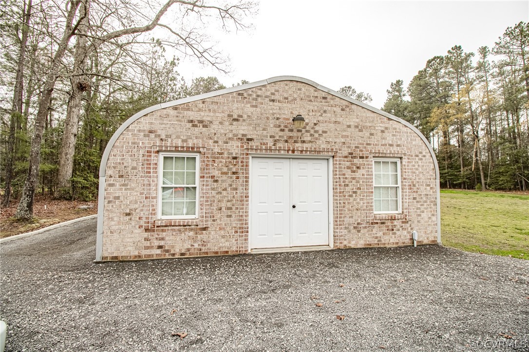 6809 West Quaker Road Disputanta, VA 23842 - Photo 41 of 49 a view of a house with a backyard