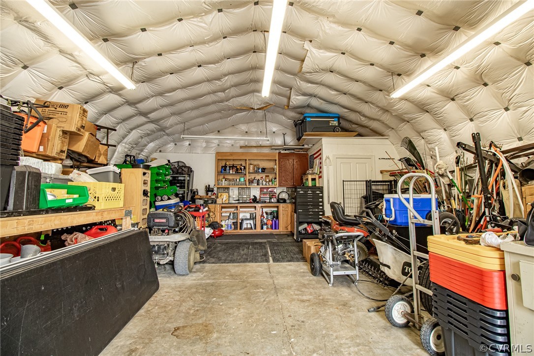 6809 West Quaker Road Disputanta, VA 23842 - Photo 42 of 49 a view of a storage room with a lot of stuff