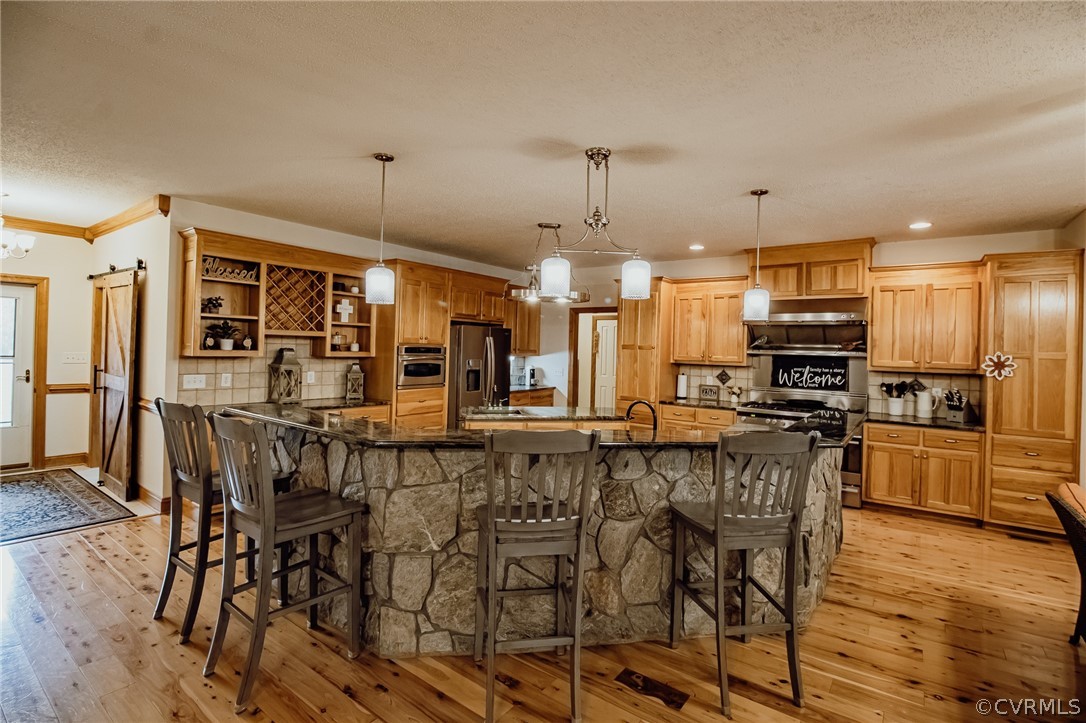6809 West Quaker Road Disputanta, VA 23842 - Photo 9 of 49 a large kitchen with a table and chairs
