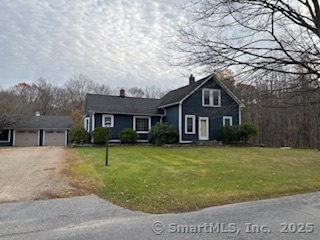 175 Pine Street Columbia, CT 06237 - Photo 2 of 29 a front view of a house with a yard