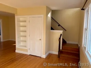 a view of entryway with wooden floor and door