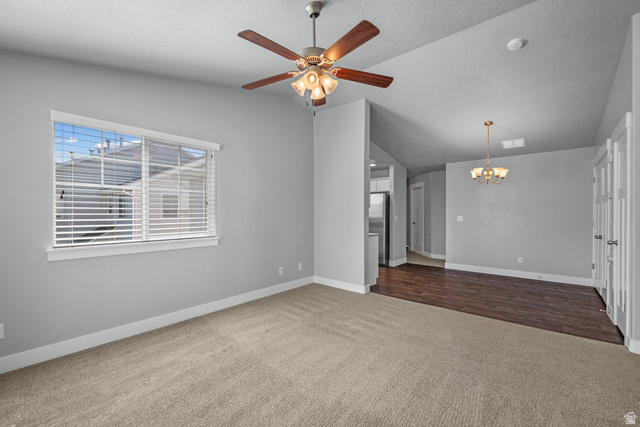 2457 West 500 South, Unit 2 Springville, UT 84663 - Photo 9 of 27 Open-concept interior featuring light gray walls, carpet flooring, a ceiling fan with integrated lighting, and a window with blinds
