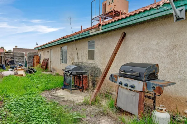 a couple of people sitting in roof of a house