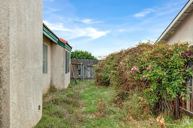 a backyard of a house with lots of green space