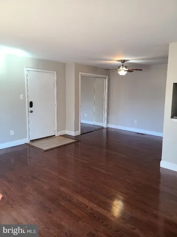 a view of livingroom with hardwood floor and ceiling fan