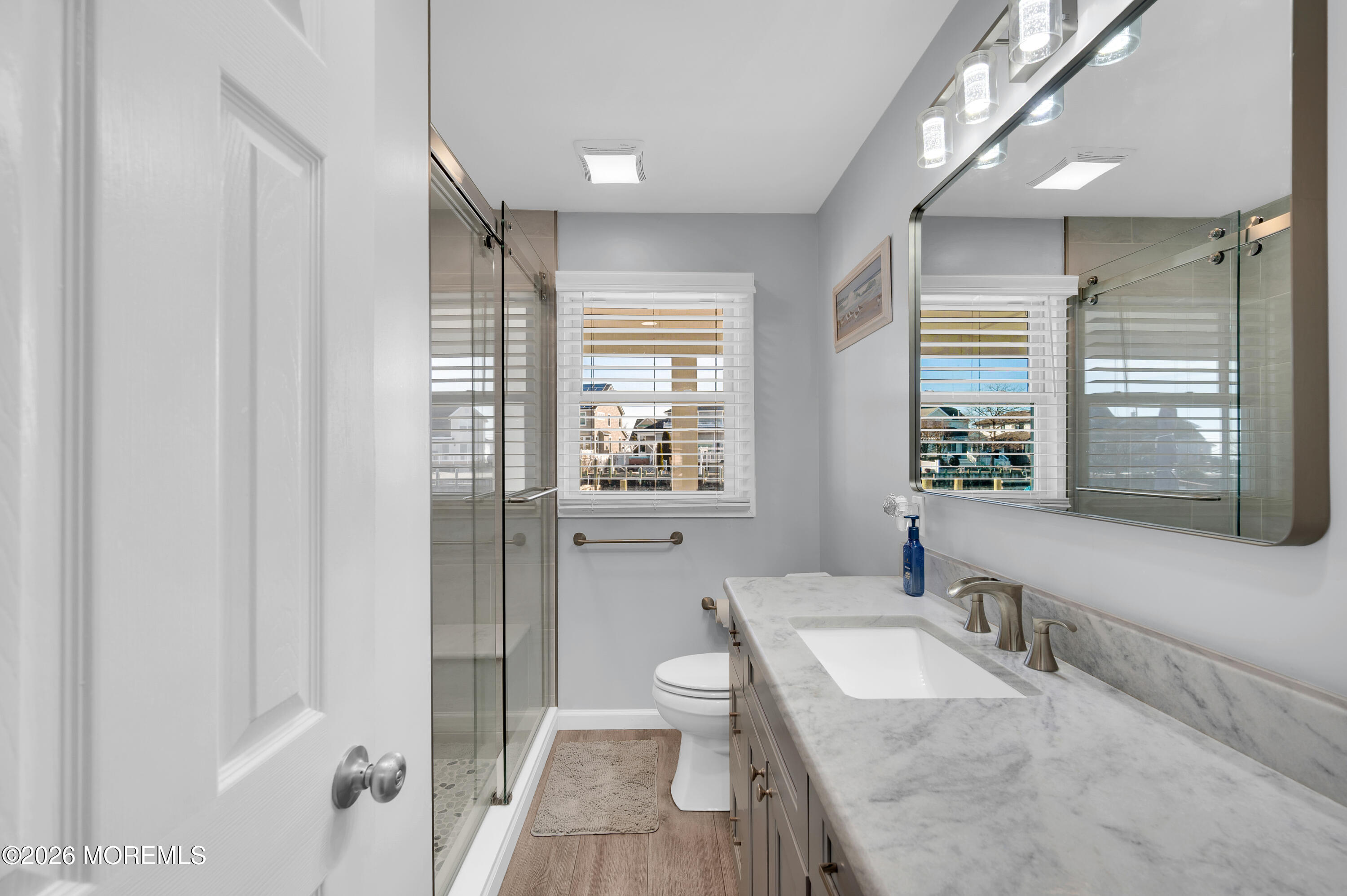204 Biscayne Road Barnegat, NJ 08005 - Photo 23 of 43 a spacious bathroom with a granite countertop sink a toilet and a large mirror