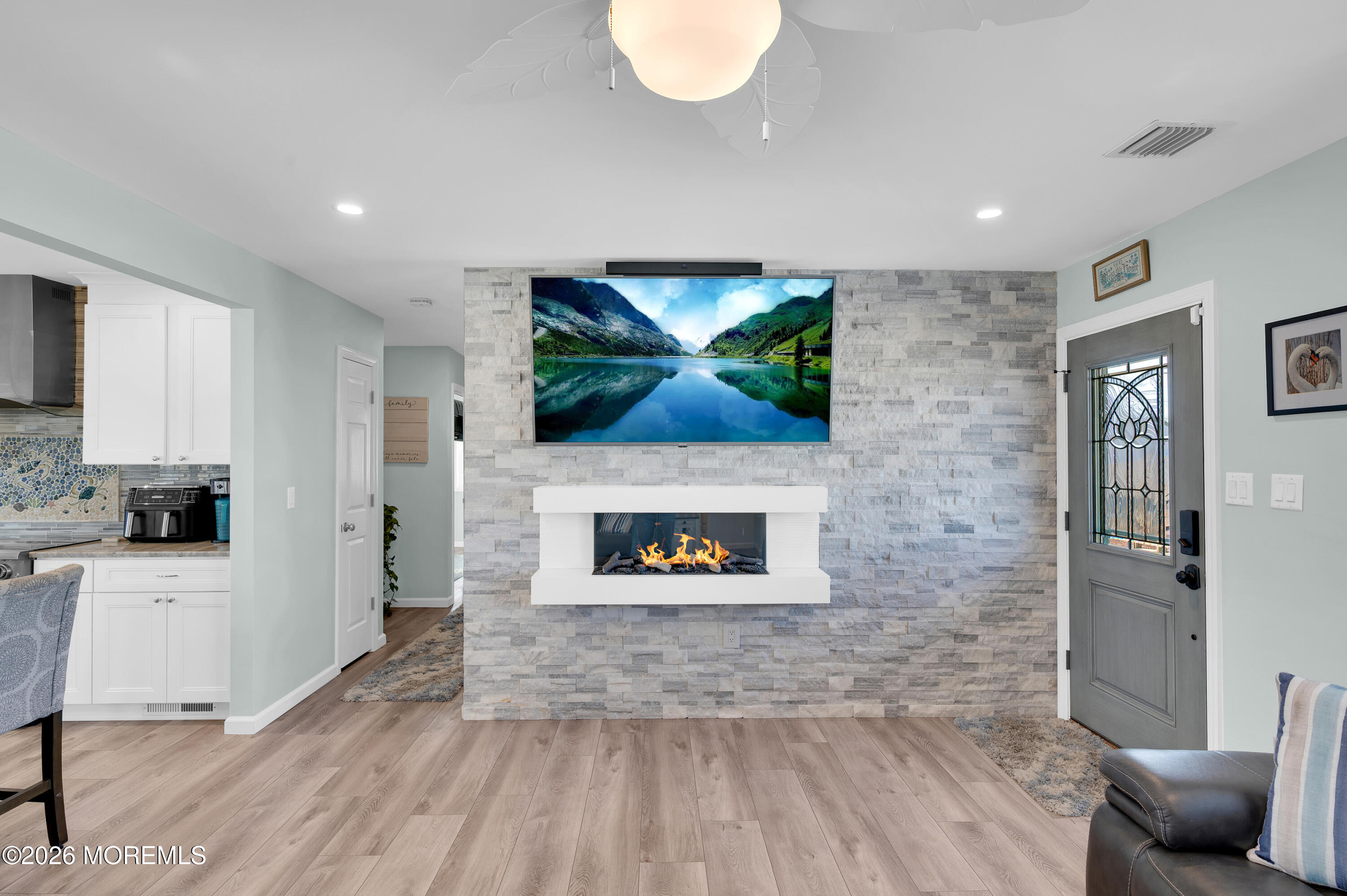 204 Biscayne Road Barnegat, NJ 08005 - Photo 8 of 43 a living room with furniture and a fireplace
