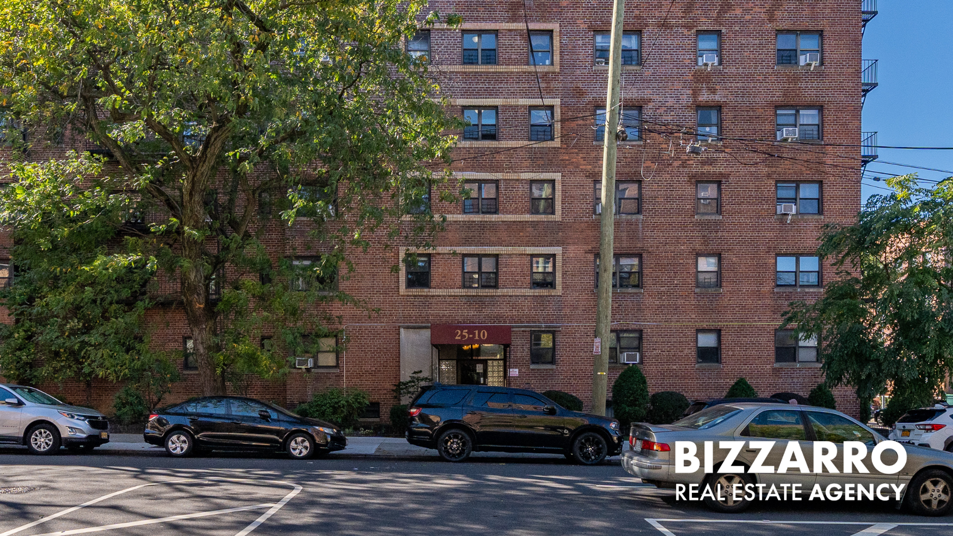 25-10 31st Avenue, Unit 5G Queens, NY 11106 - Photo 13 of 14 a car parked in front of a brick house