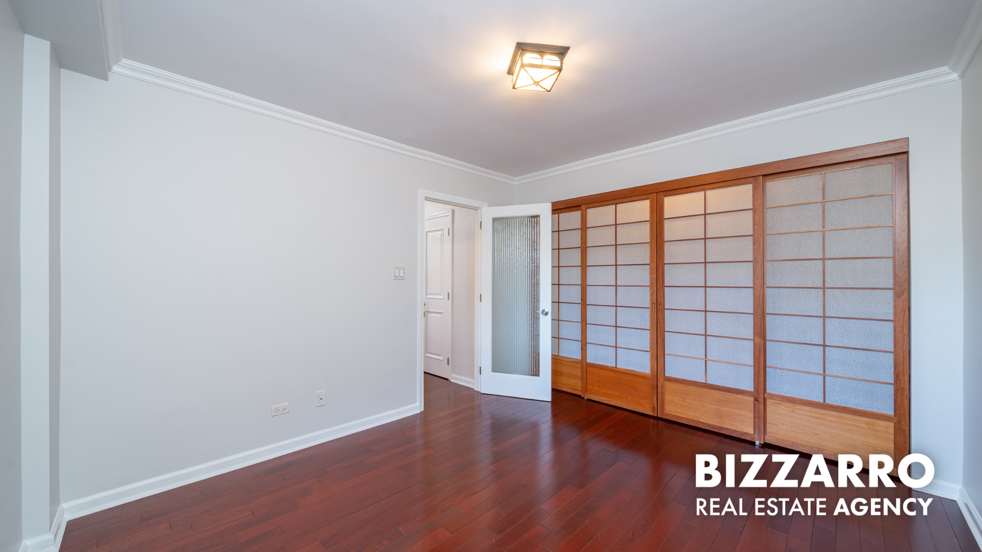 25-10 31st Avenue, Unit 5G Queens, NY 11106 - Photo 9 of 14 a view of an empty room with window
