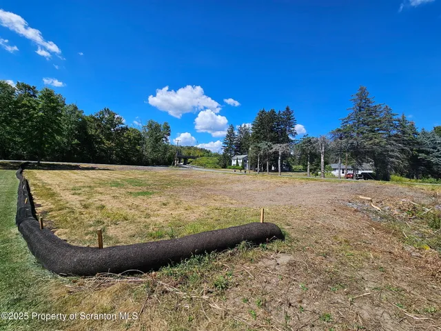 a view of a swimming pool with a yard