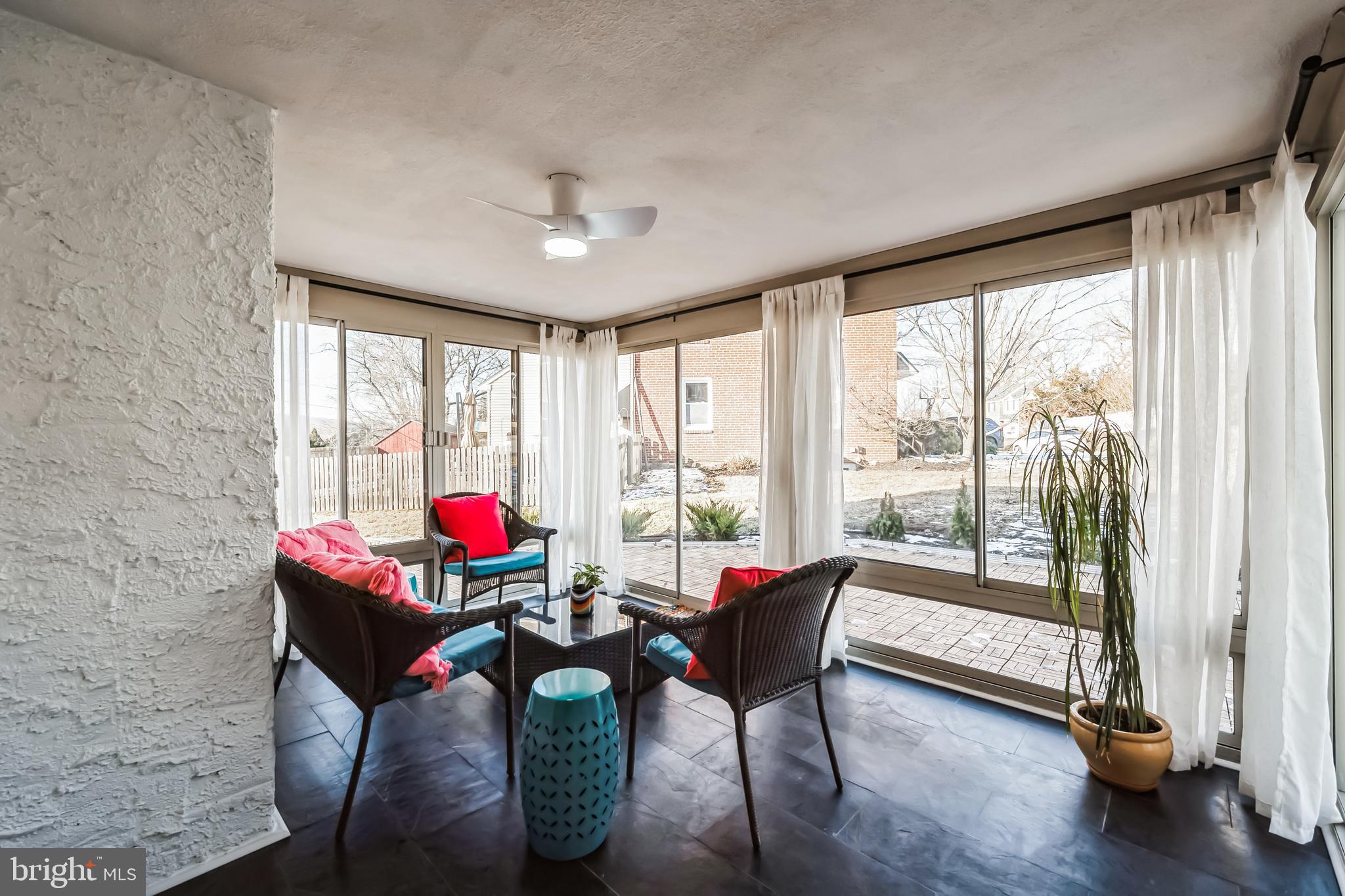 638 Wagner Road Lafayette Hill, PA 19444 - Photo 8 of 27 Sunroom with View of Side Patio with Furniture
