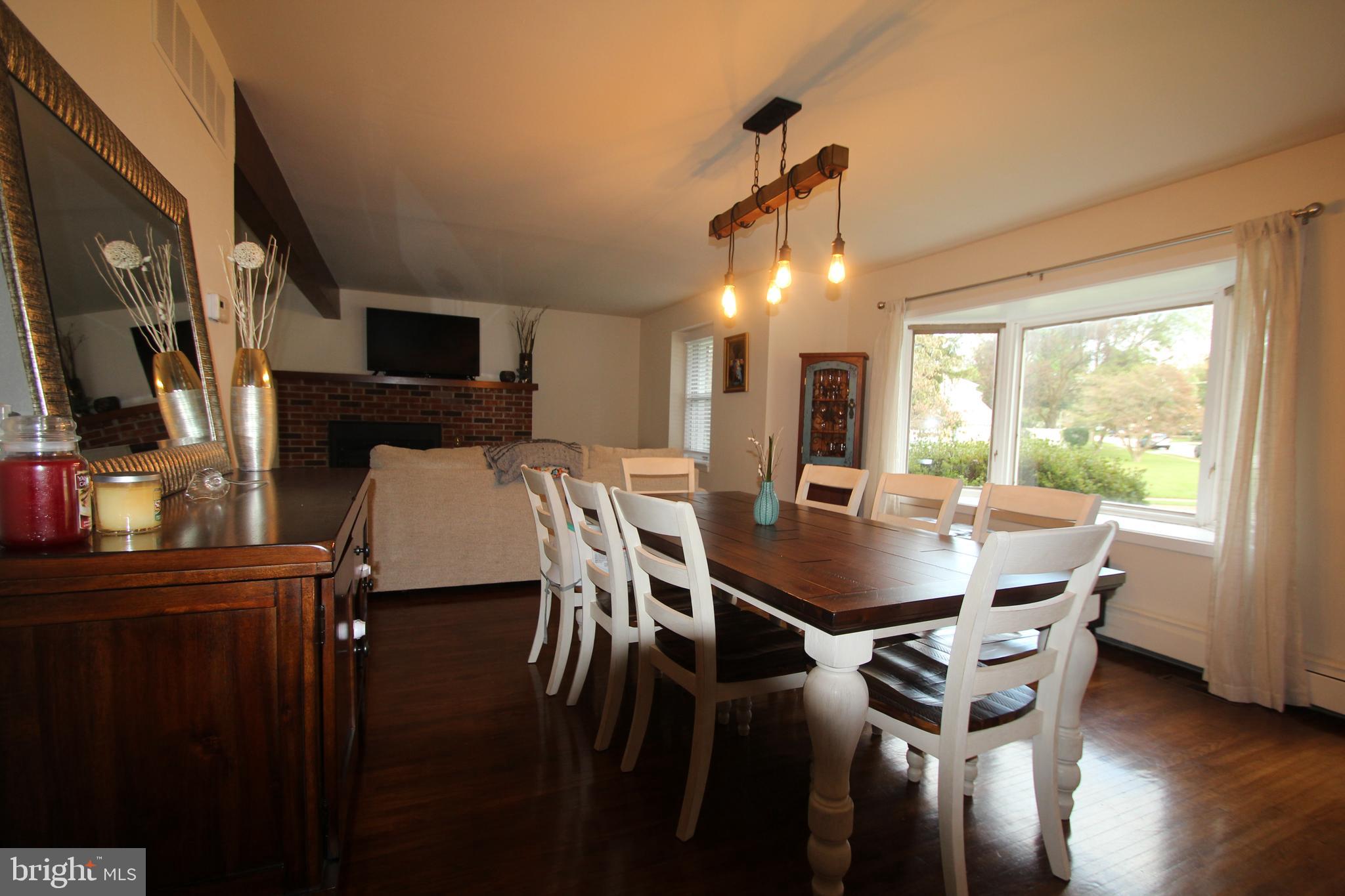 201 Spruce Road Flourtown, PA 19031 - Photo 5 of 39 a view of a dining room with furniture window and wooden floor