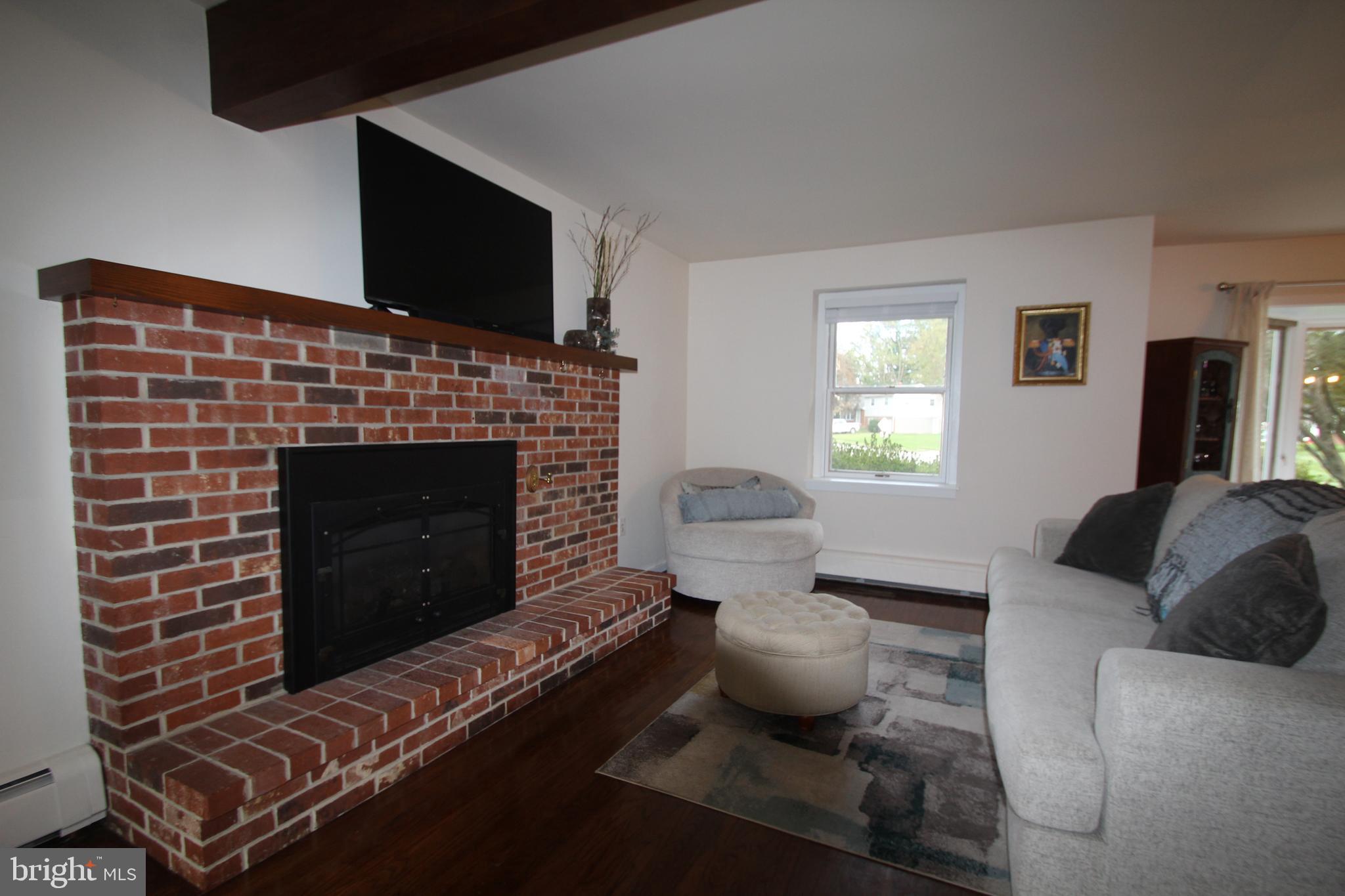 201 Spruce Road Flourtown, PA 19031 - Photo 7 of 39 a living room with furniture and a fireplace