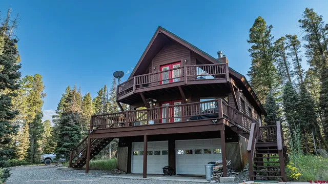 a front view of a house with a trees