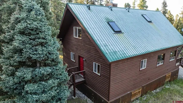 a view of a pathway of a house along with trees