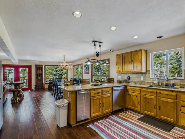 a very nice looking kitchen with a table and chairs