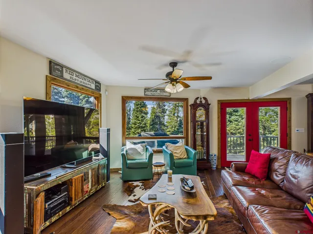 a living room with furniture fireplace and flat screen tv