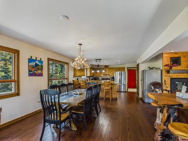 a front view of a house with outdoor seating