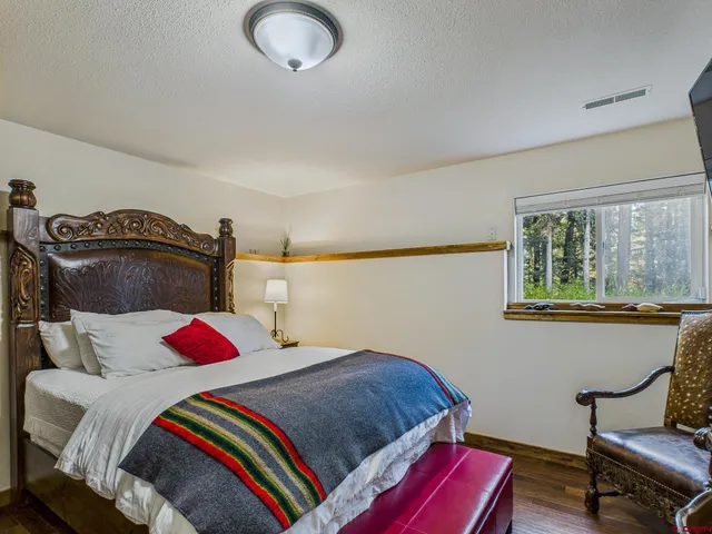 a bathroom with a sink toilet mirror and shower